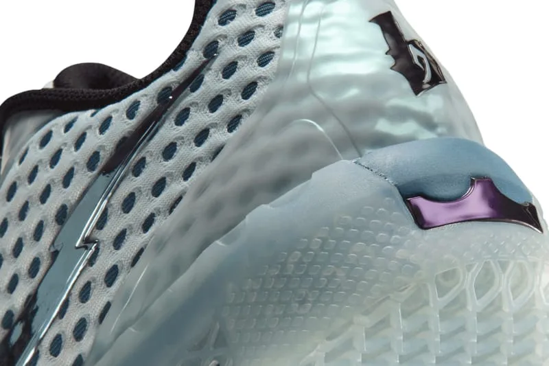 Close-up of heel detail, translucent clip, black logo, blue and purple insert, perforated mesh, Fiberglass