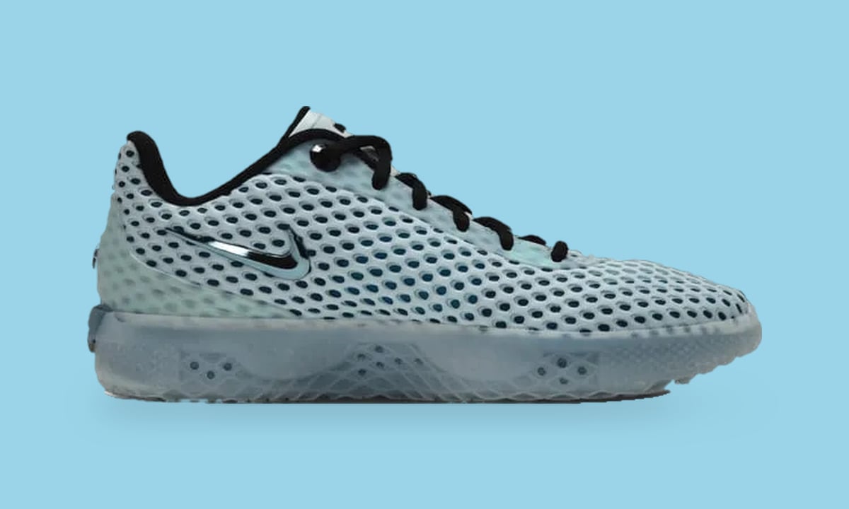 Medial view on light blue, pale perforated mesh upper, black laces, small chrome swoosh, Fiberglass