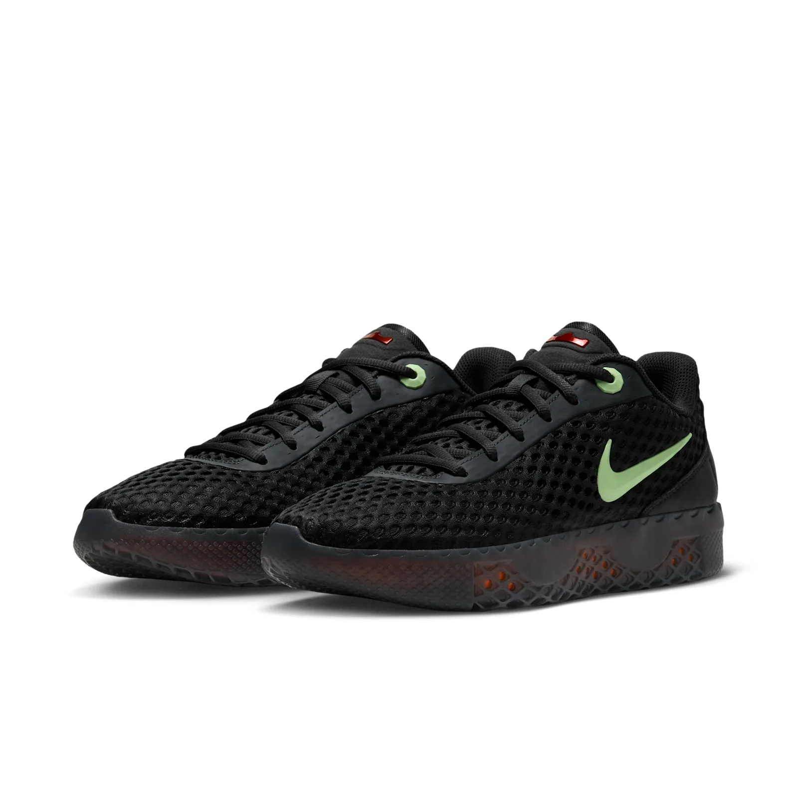 Pair at a front three-quarter angle with black mesh and pale green Swooshes, Halloween