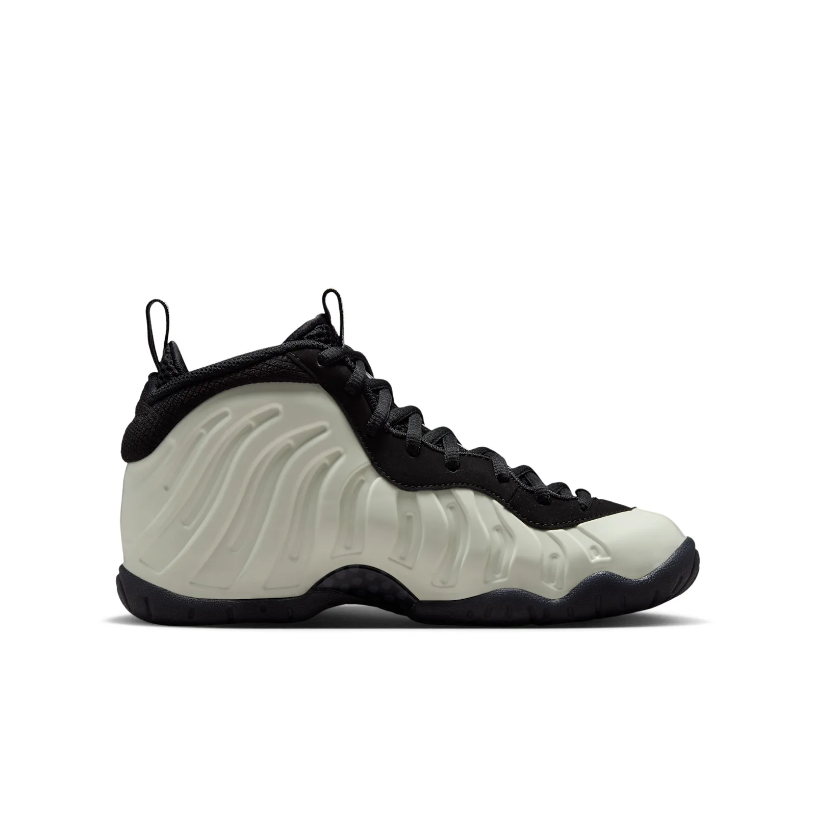 Medial view, pale off-white ridged shell, black collar and laces, black sole, Glow In The Dark