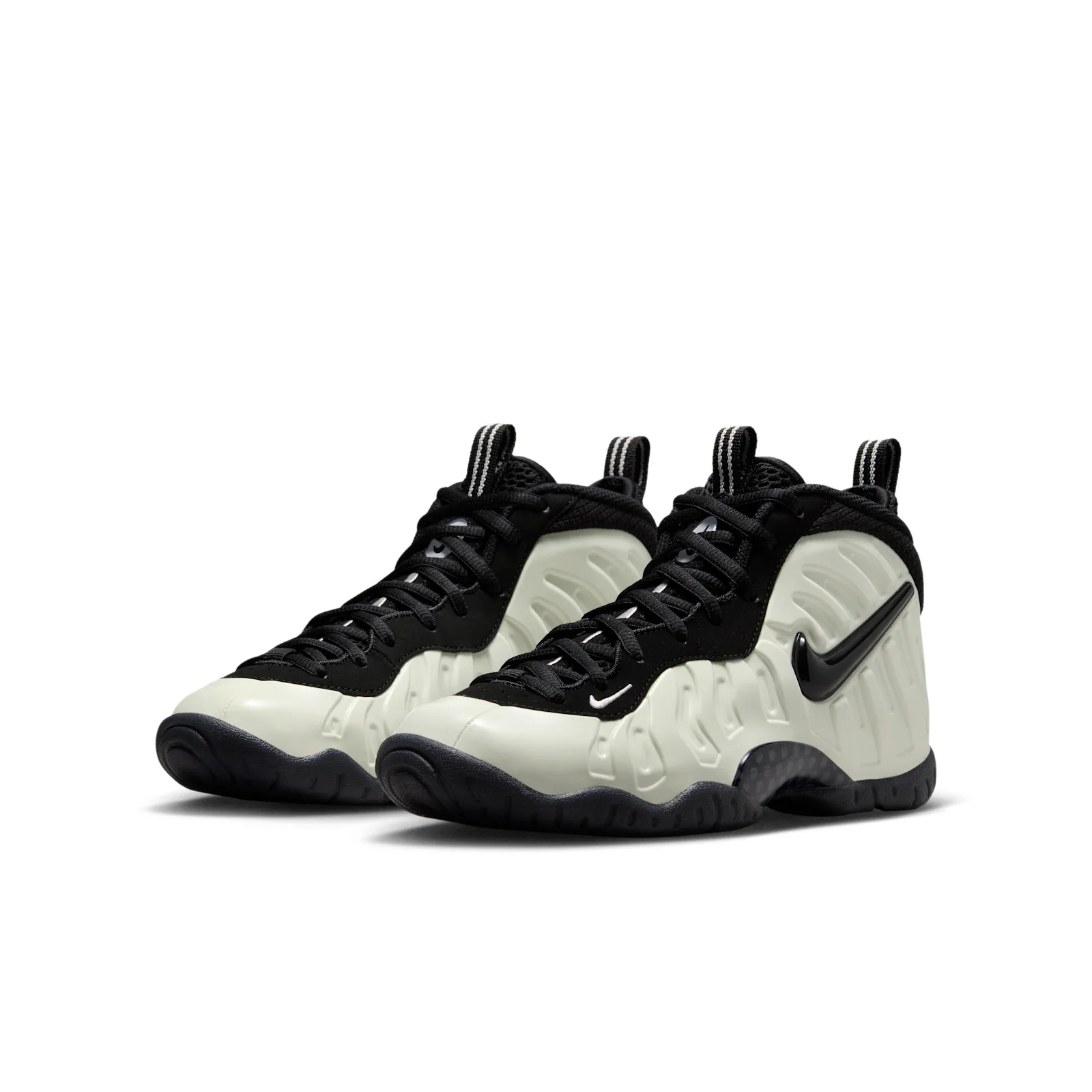Pair at three-quarter angle, pale off-white shells with black laces and sole, Glow In The Dark