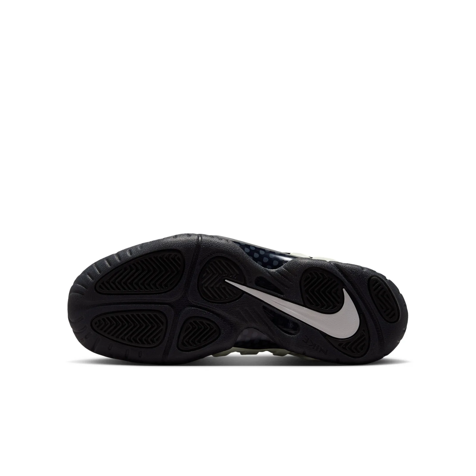 Outsole view, black tread pods with a large pale swoosh and dotted midsole panel, Glow In The Dark