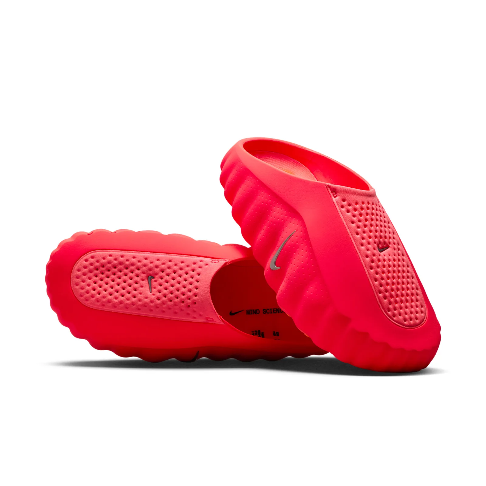 pair shot, one shoe inverted revealing orange-studded sole and black insole text, Solar Red