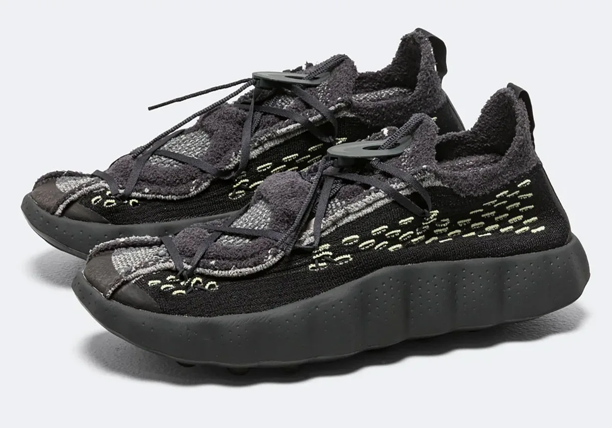 Pair at three-quarter angle, shaggy dark grey lace overlay and toggle lacing, Black/Dark Smoke Grey
