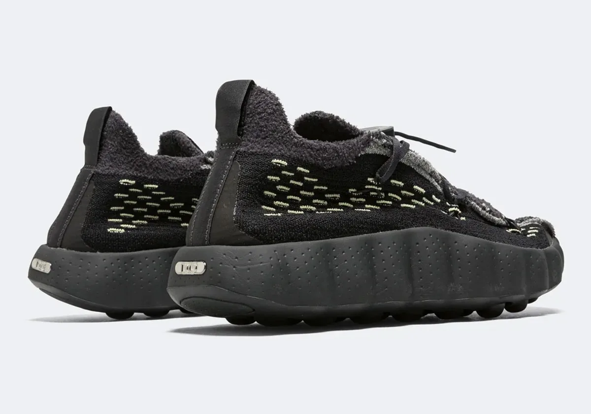 Pair from the heel, pull tabs, pale green knit pattern and metal tag on midsole, Black/Dark Smoke Grey