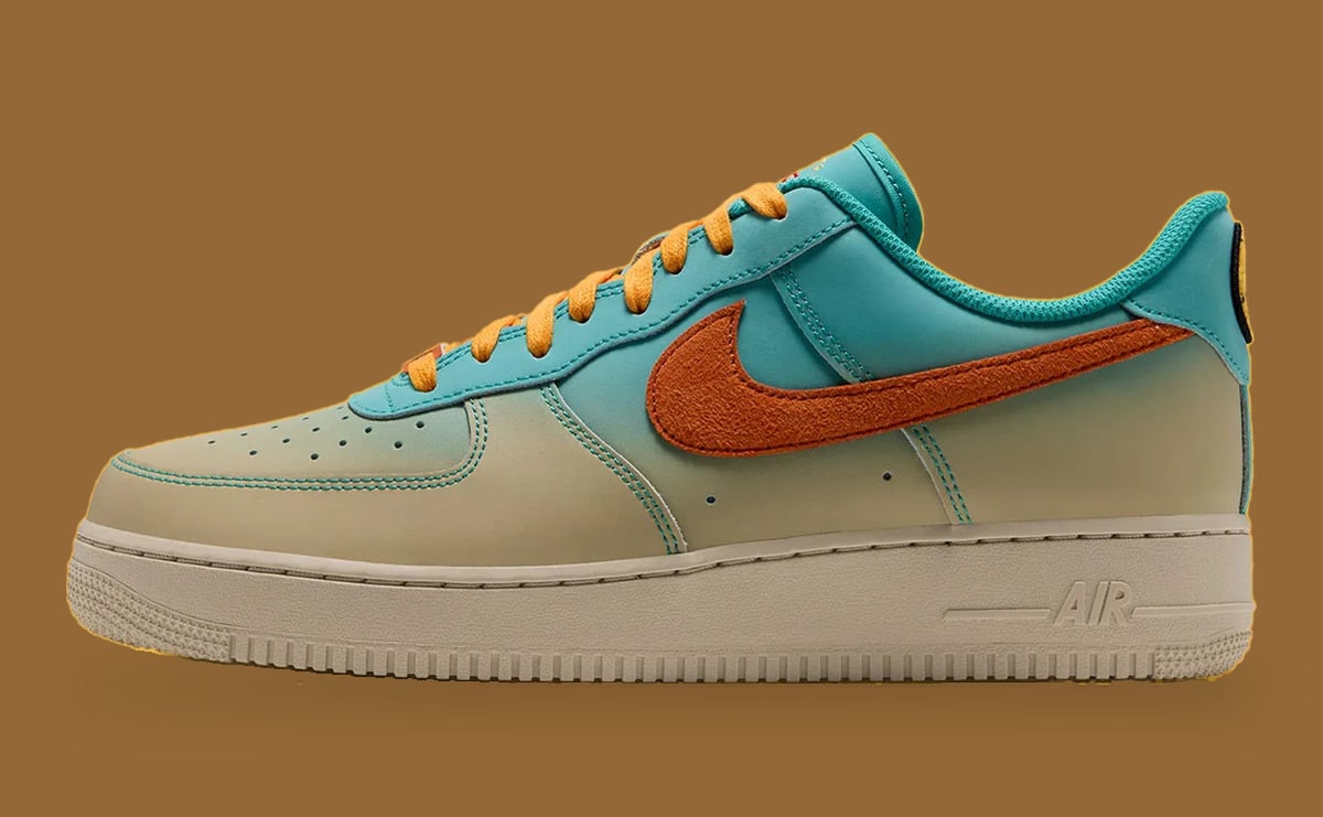 Side view, teal-to-cream leather, large orange suede swoosh, yellow laces, AIR on cream midsole, Holiday 2026 Collection