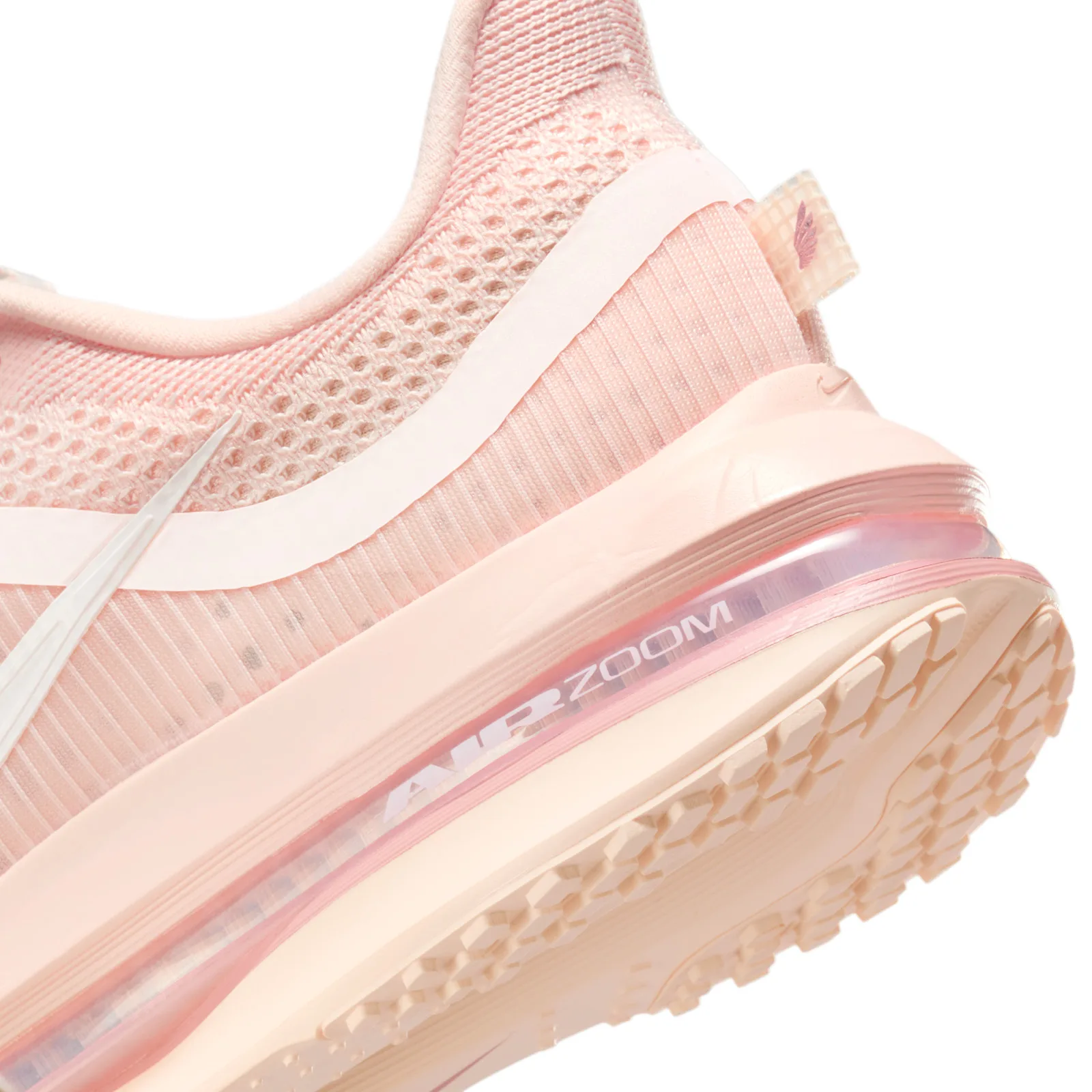 Heel detail, pale pink mesh, "Air Zoom" printed on the air unit, peach outsole lugs on white, Guava Ice