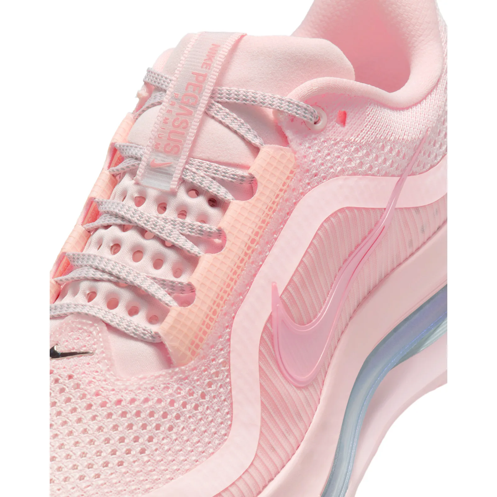 Detail of laces and "Pegasus Premium" tongue tag, pink mesh, translucent pink swoosh, white background, Guava Ice