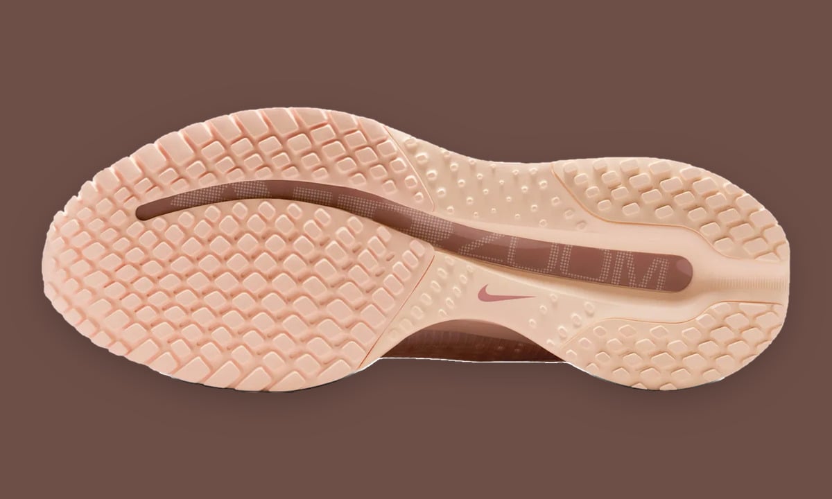 Outsole view, peach rubber lugs with a brown "Zoom" channel and pink swoosh on brown, Guava Ice