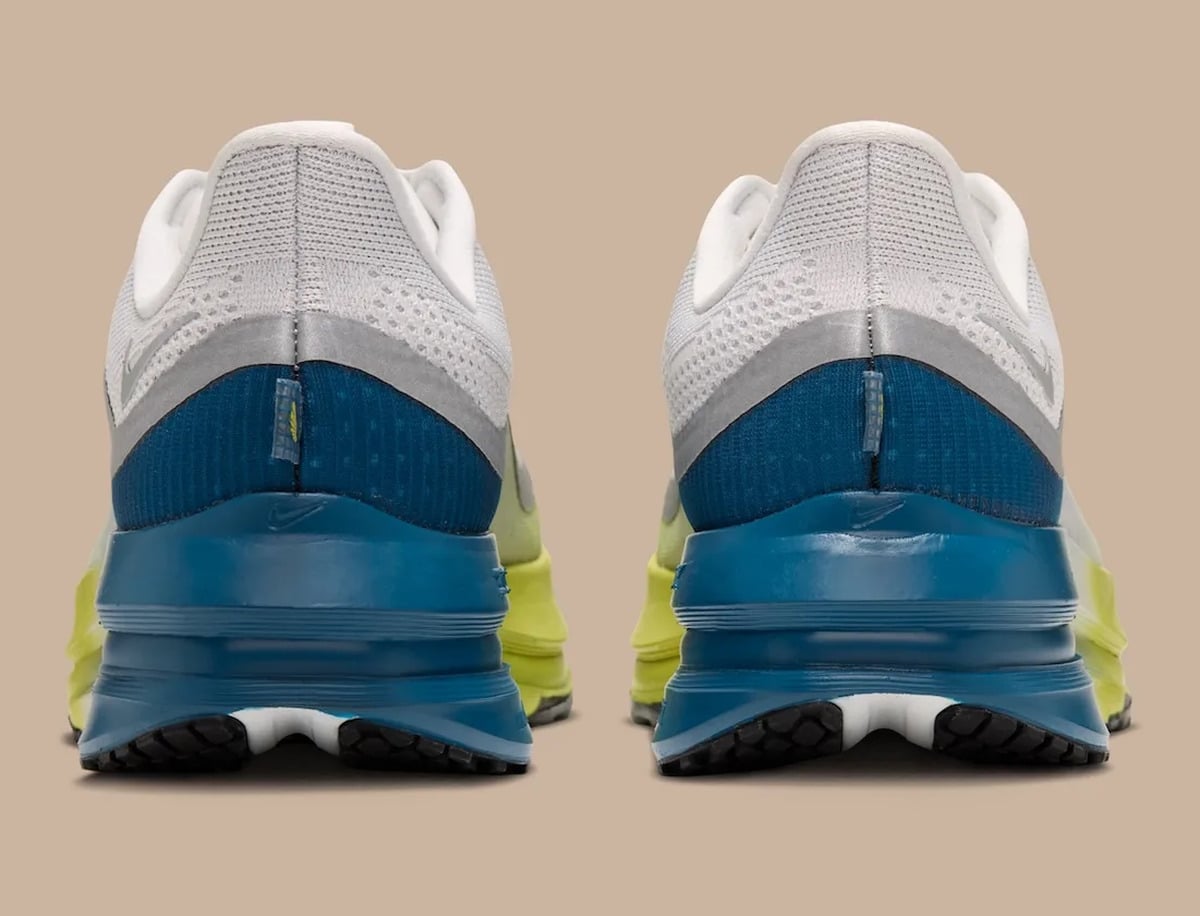 Pair from heel, blue heel counter and midsole, white mesh collar, beige backdrop, The Perfect Texture For Running