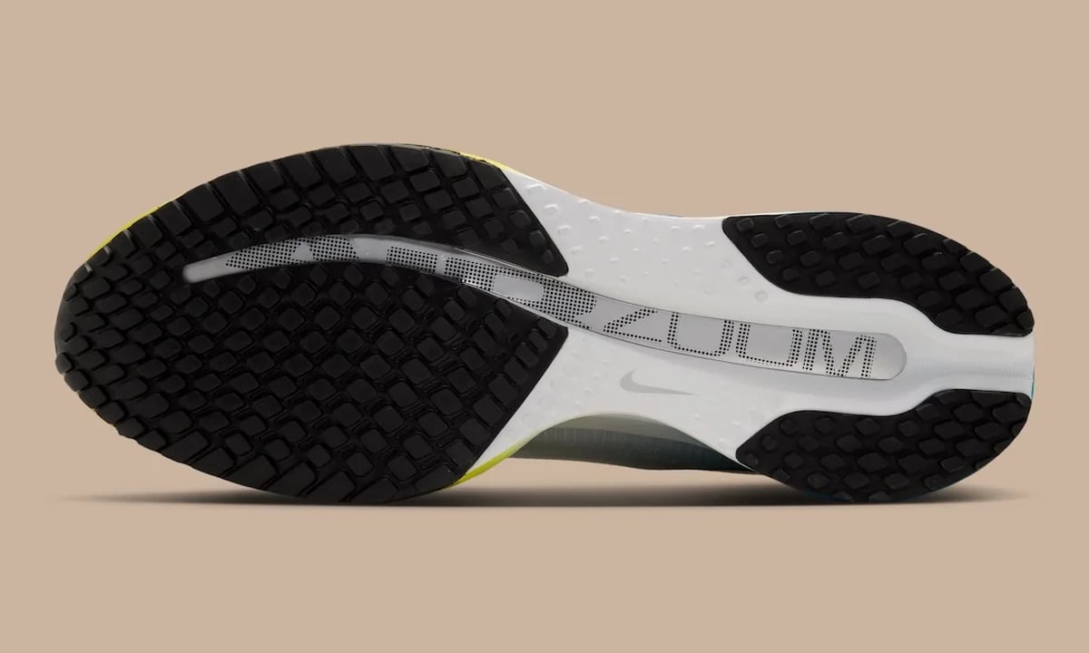 Outsole view, black rubber lugs, white midsole, silver Zoom window with dotted lettering, The Perfect Texture For Running