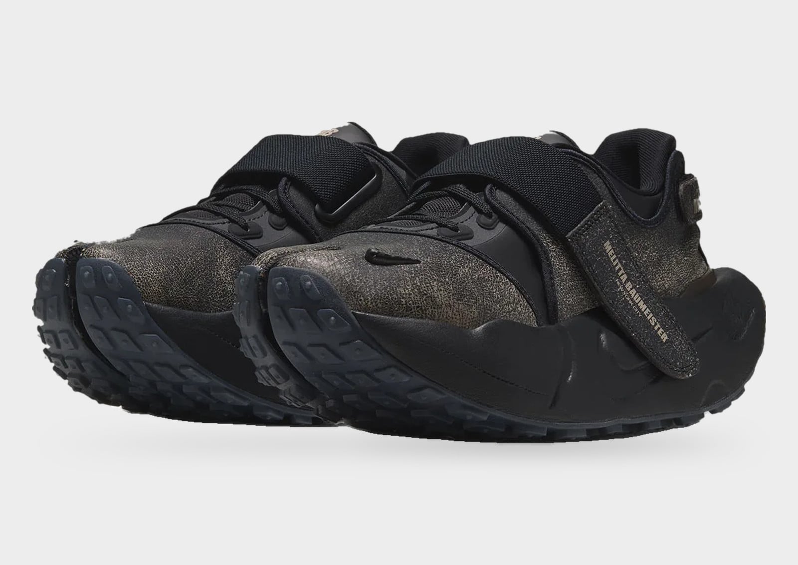 Pair, front three-quarter view with textured dark uppers and broad black straps, Melitta Baumeister x Nike Rift Rocker