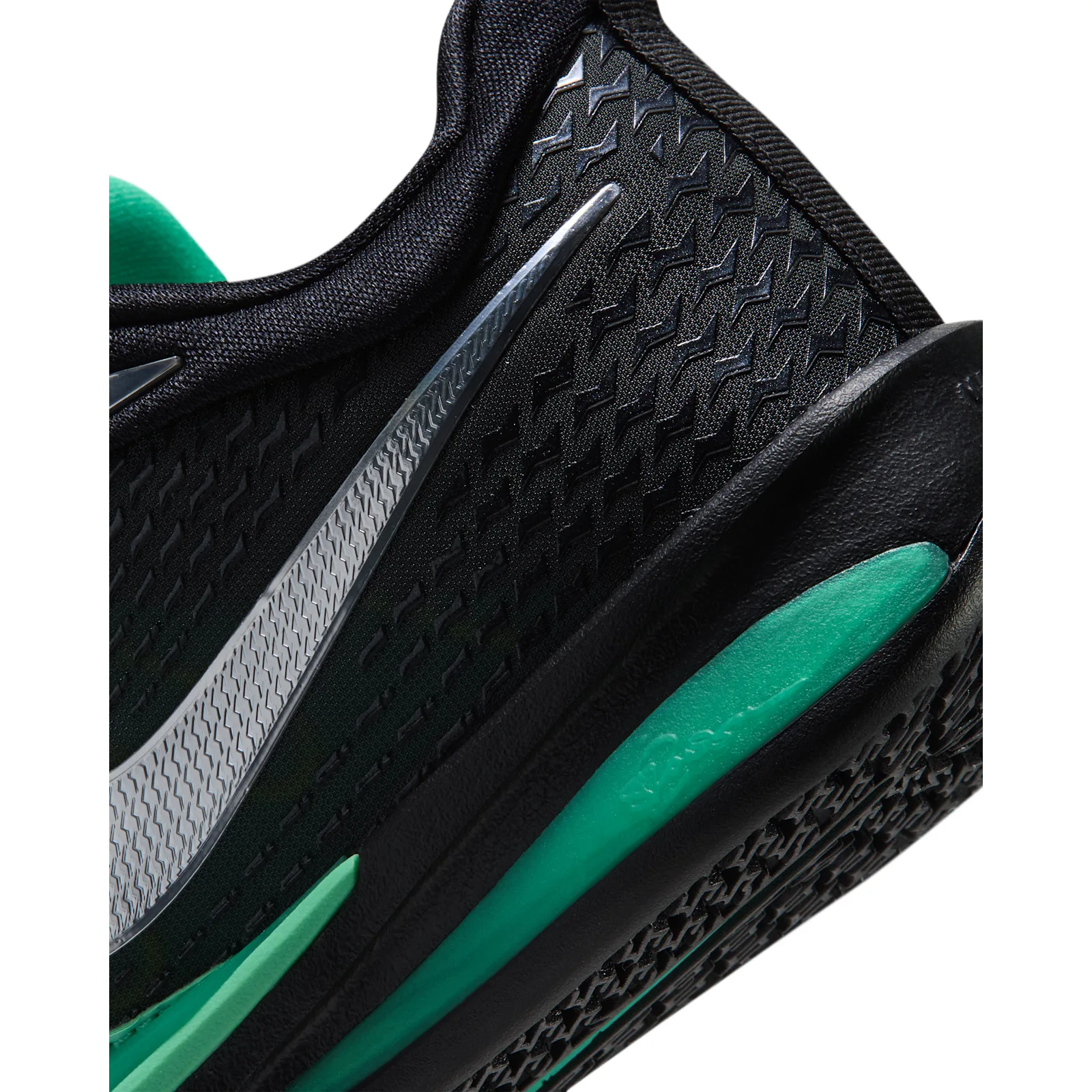 Heel detail with black textured upper, silver Swoosh and teal midsole accent, Moon Ball