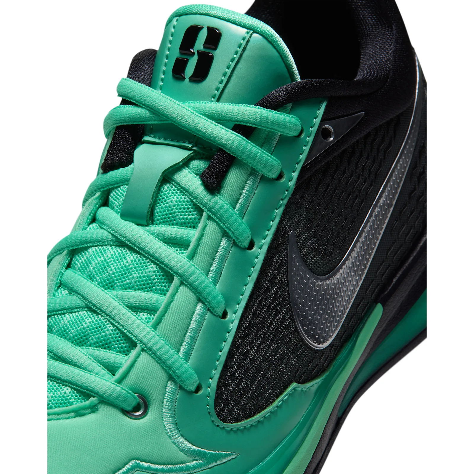 Lace detail with teal tongue and laces beside a silver Swoosh on black mesh, Moon Ball