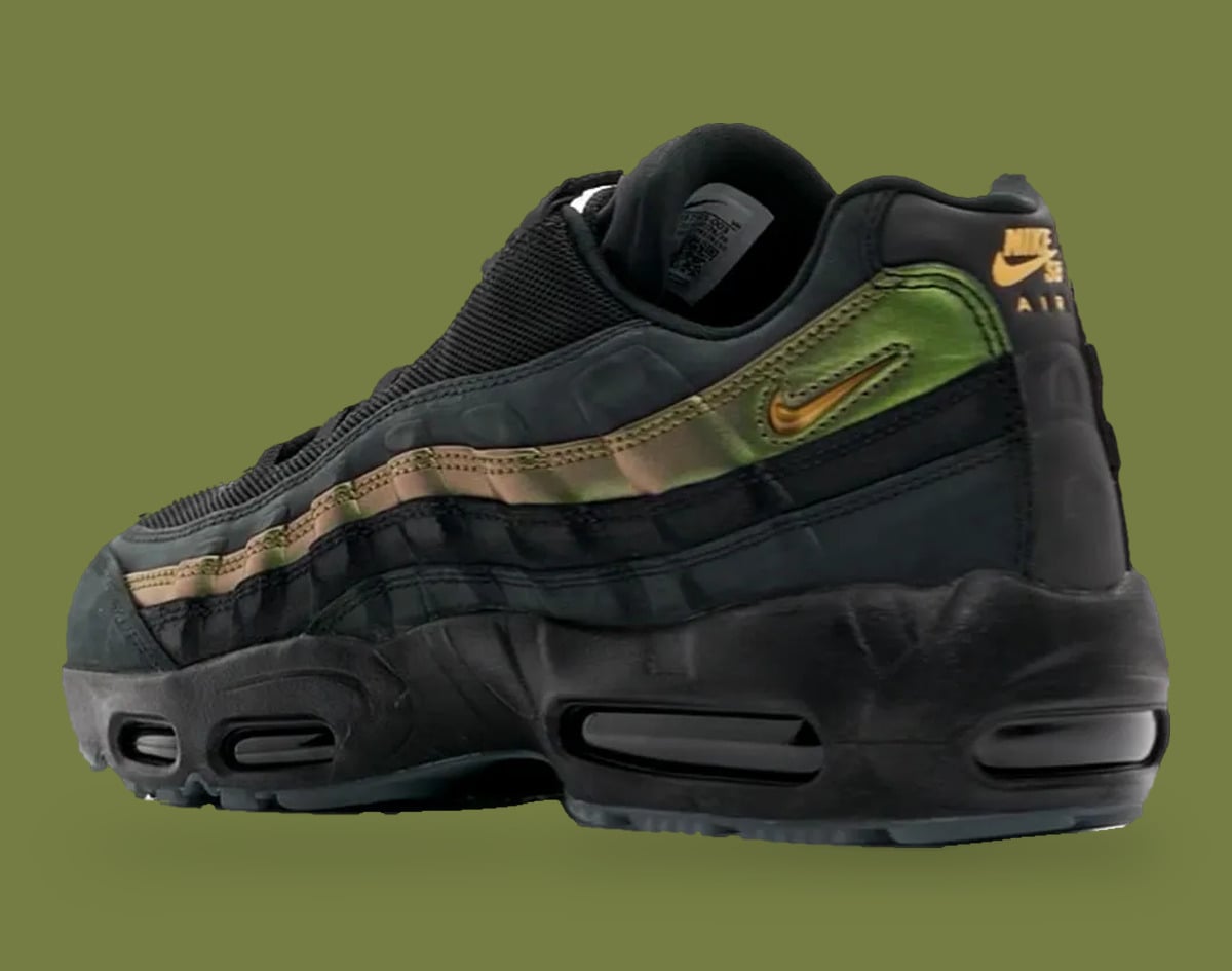 Rear three-quarter view, gold swoosh and Nike SB Air heel tab, black chunky air sole, x Kyle Wilson