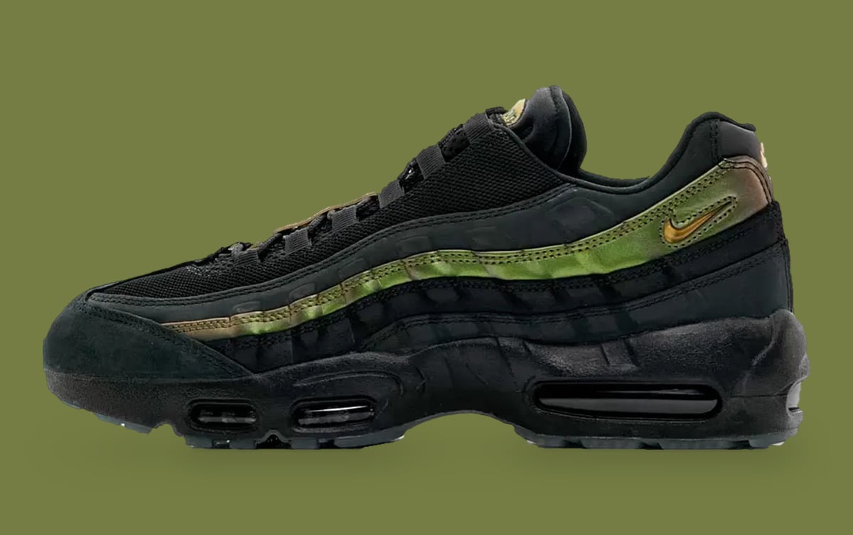 Lateral view, black suede toe and iridescent green-gold stripe on olive backdrop, x Kyle Wilson
