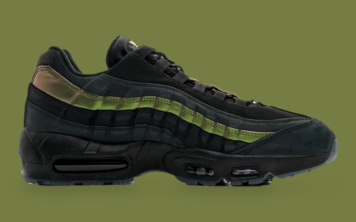 Medial view, black upper with green iridescent stripe and clear blue-grey outsole edge, x Kyle Wilson