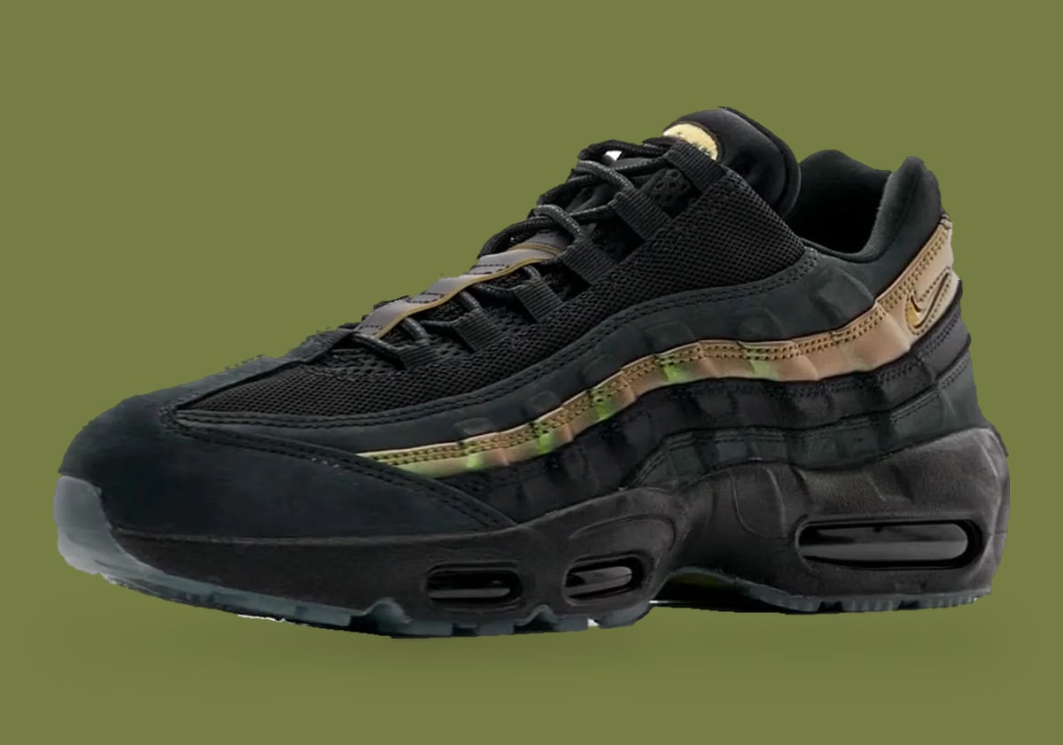 Front three-quarter view, black suede toe cap and gold-bronze stripe, visible air units, x Kyle Wilson