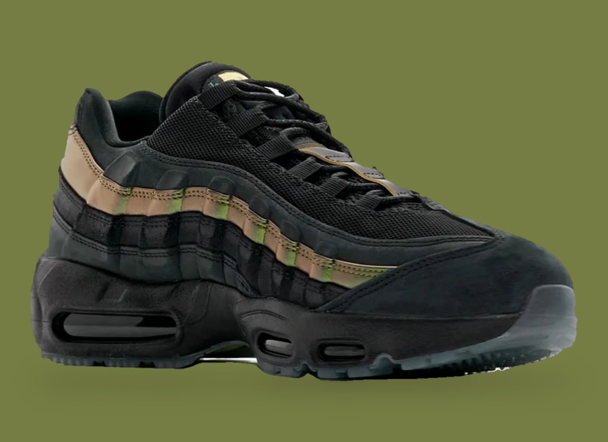 Front three-quarter view, black mesh and laces with bronze-green iridescent stripe, x Kyle Wilson