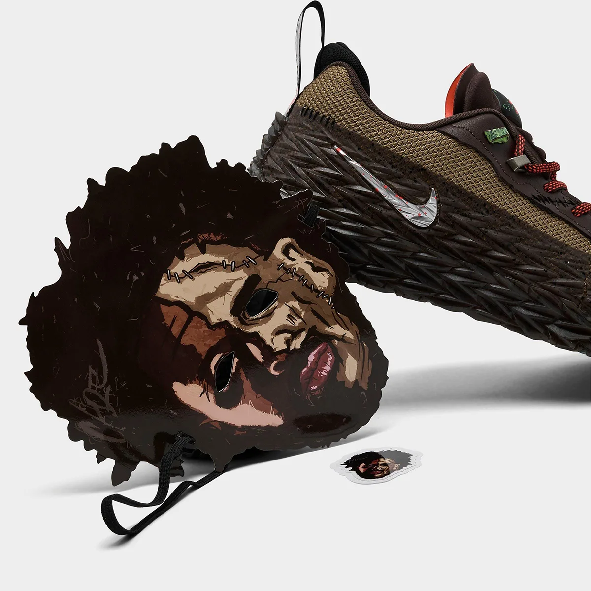 Shoe on its side behind stitched face cutout with elastic strap and small sticker, Halloween