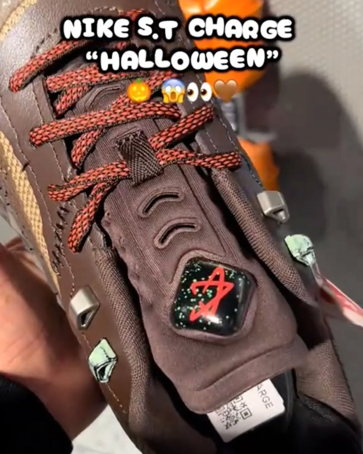 On-hand close-up of tongue with red star badge, red laces, caption text overlay, Halloween