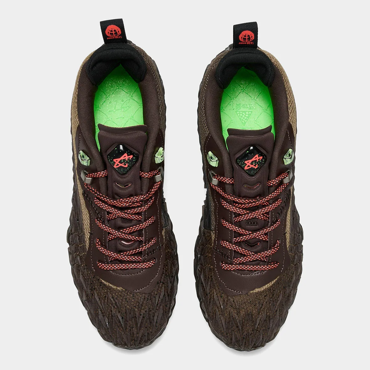 Top-down view of pair with red laces, bright green insoles and star badge, Halloween