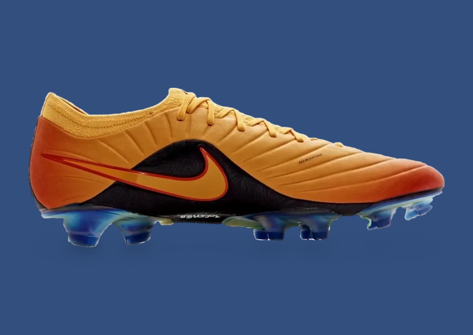 Lateral view of orange-yellow gradient boot with black panel, orange swoosh and blue studs on blue backdrop, Sundial