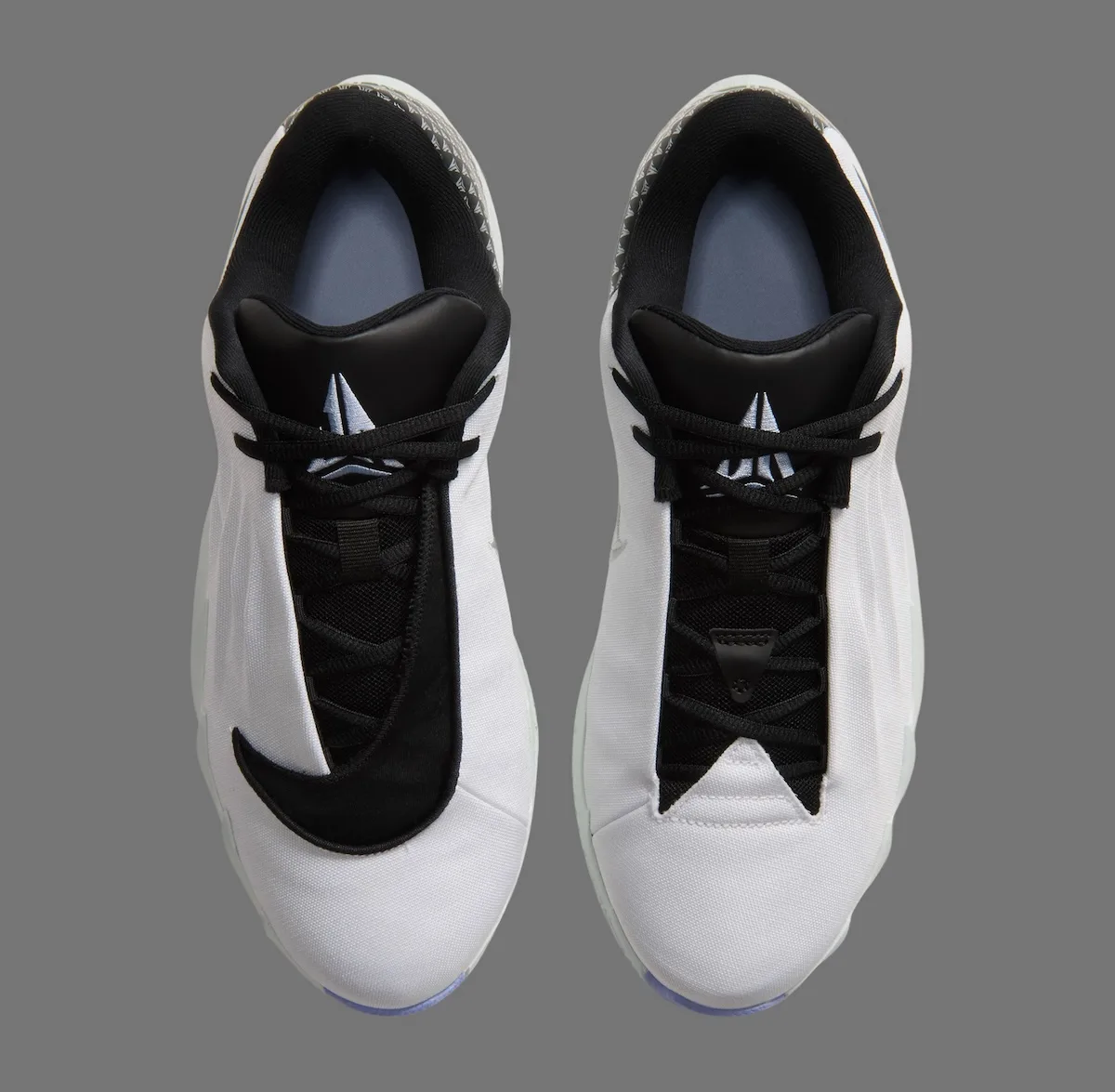 top-down pair view, white uppers with black tongues and mint blue interior lining, White