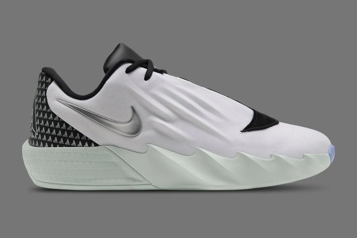 lateral view, white upper with black toe cap and mint green ridged outsole, White