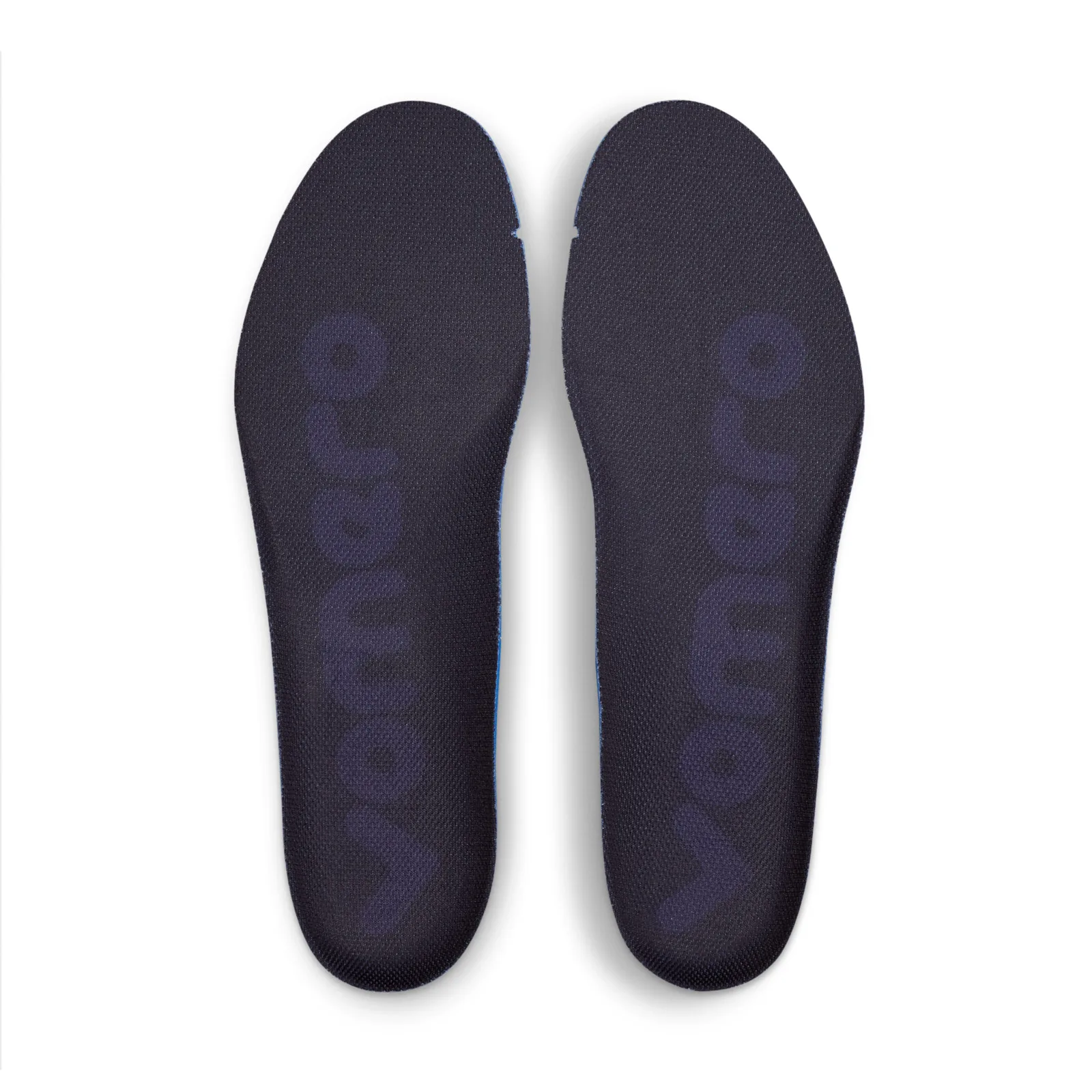 Top-down view of a pair of dark navy insoles with large faint lettering, Gridiron