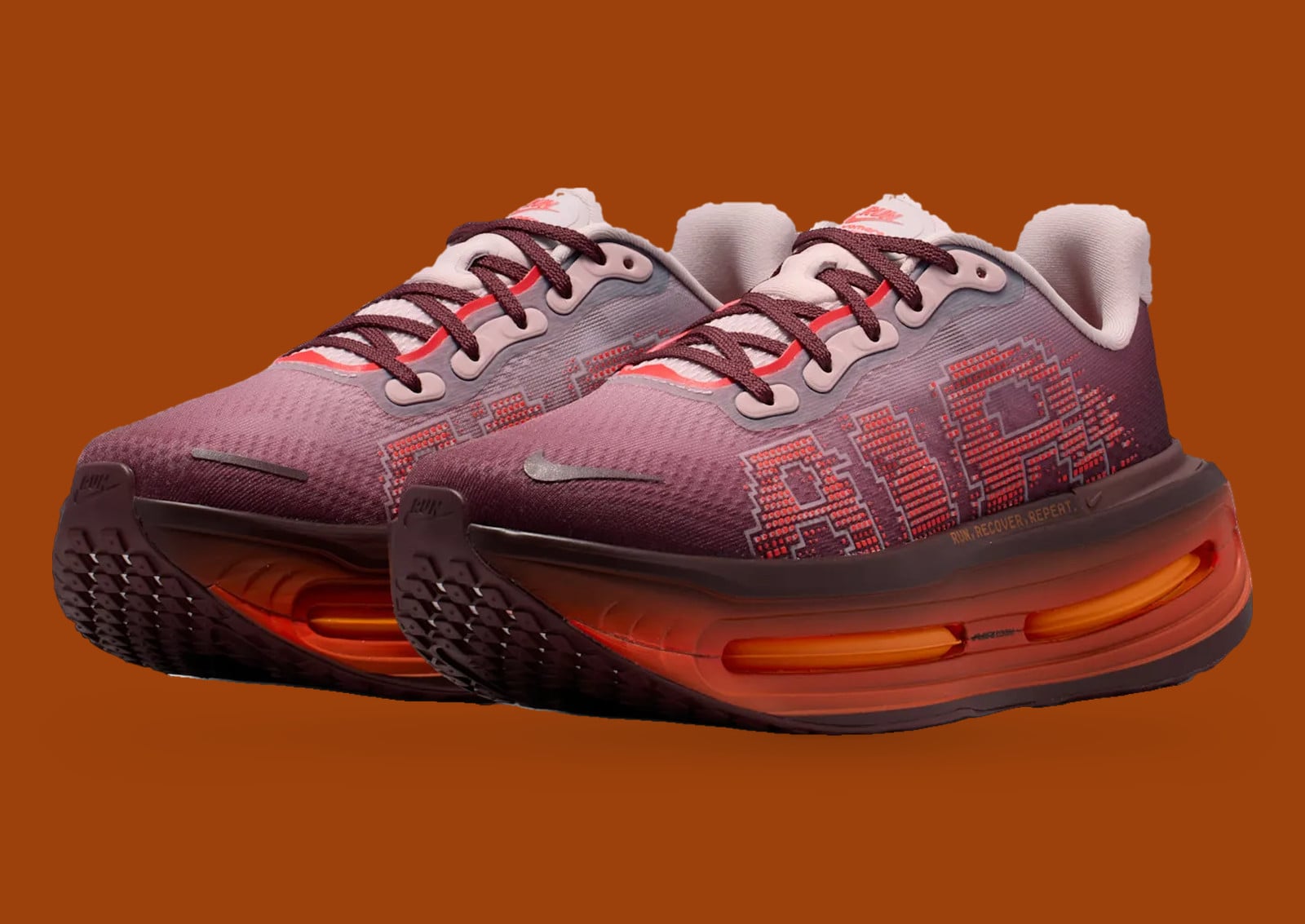 Pair, three-quarter view, burgundy mesh with red pixel AIR print on brown, Nike Vomero Premium “Shanghai”