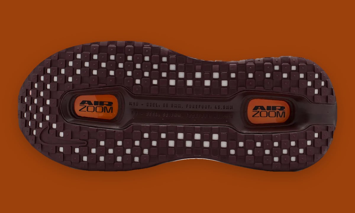 Outsole, dark burgundy checker tread, orange AIR ZOOM units in the middle, Shanghai