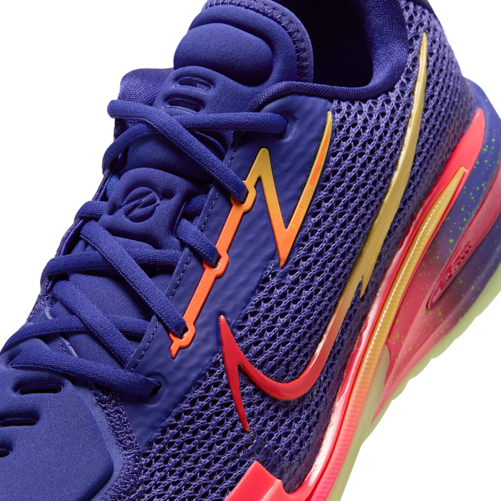 Close-up of lacing area, blue laces, orange and yellow bolt overlay, red swoosh, speckled midsole, Purple Comet