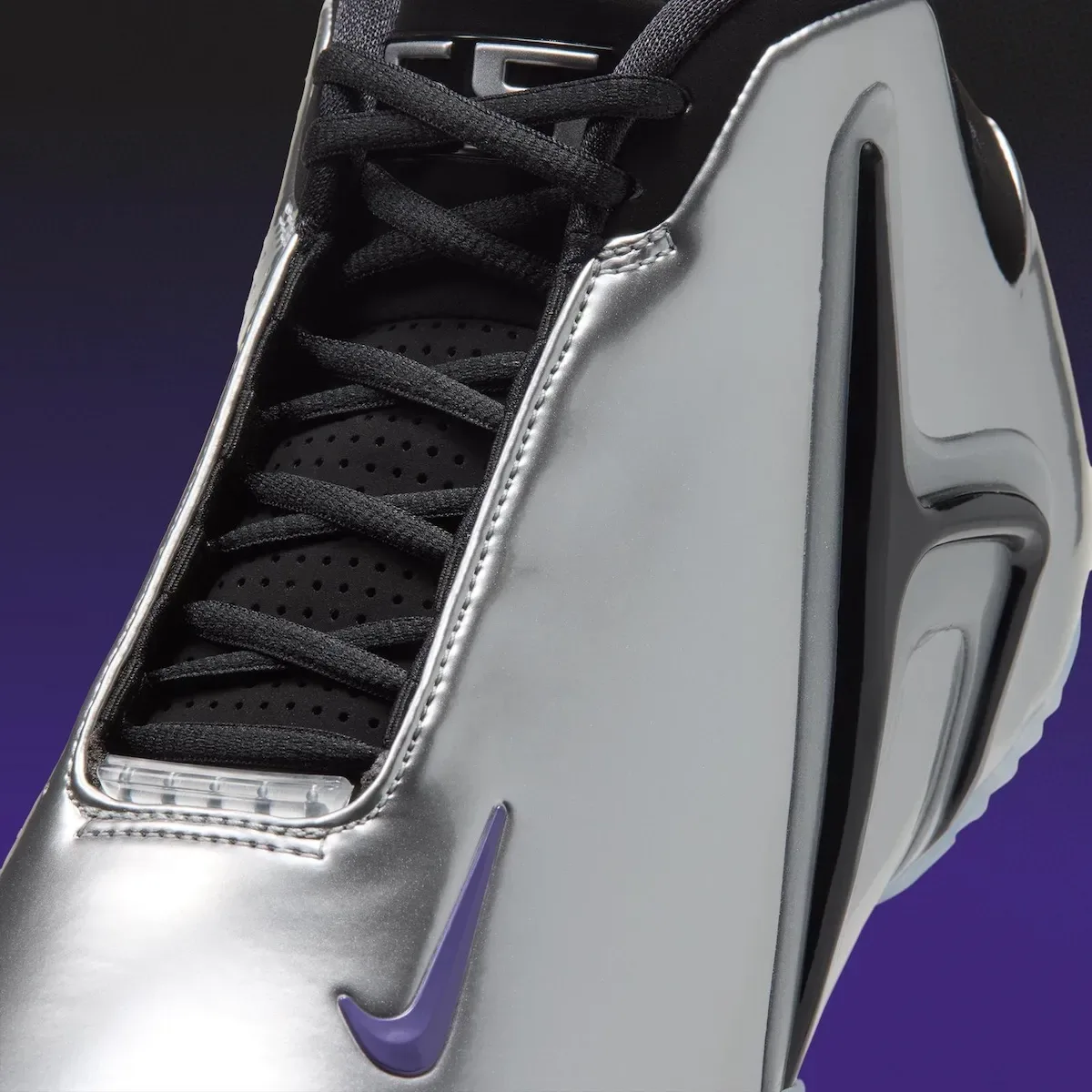 Close-up of black laces and silver patent upper, purple swoosh on purple backdrop, Platinum