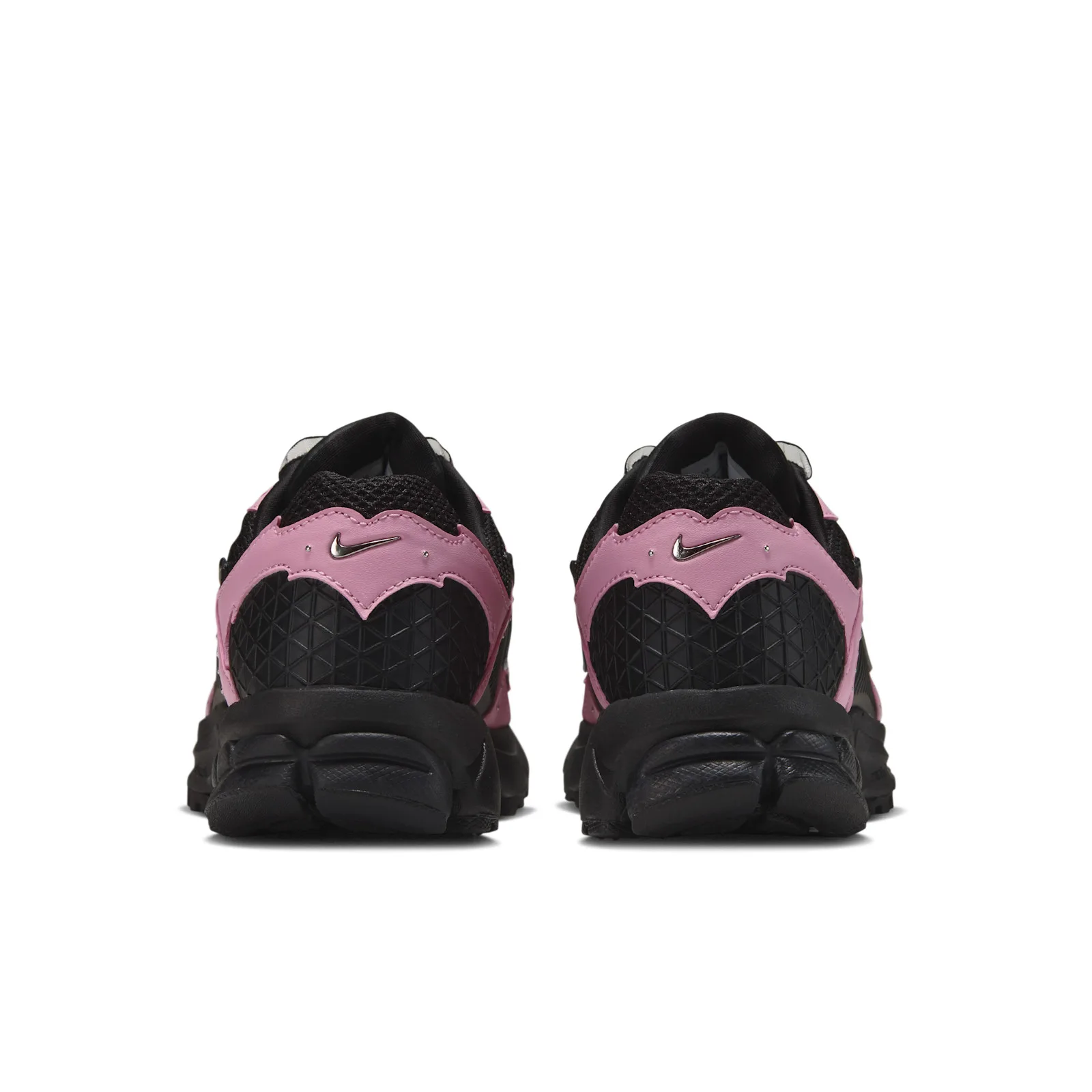 Heel view of pair with pink overlays and black triangular grid panels, Black/Pink