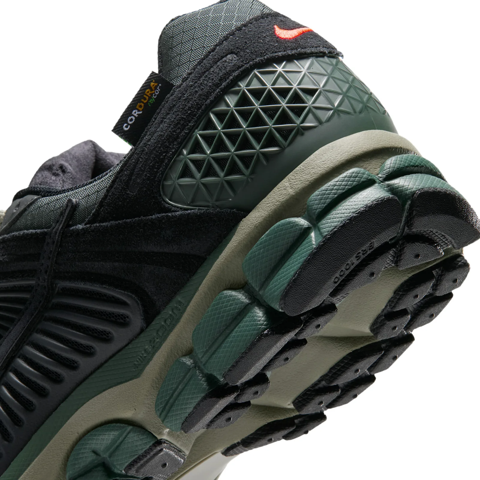 Heel detail with a Cordura tag, green geometric cage and orange Swoosh, Camo Green