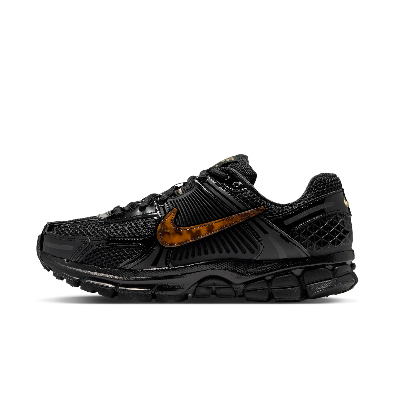 Lateral view on white, black mesh upper with ribbed panels and brown tortoiseshell swoosh, Tortoise Shell