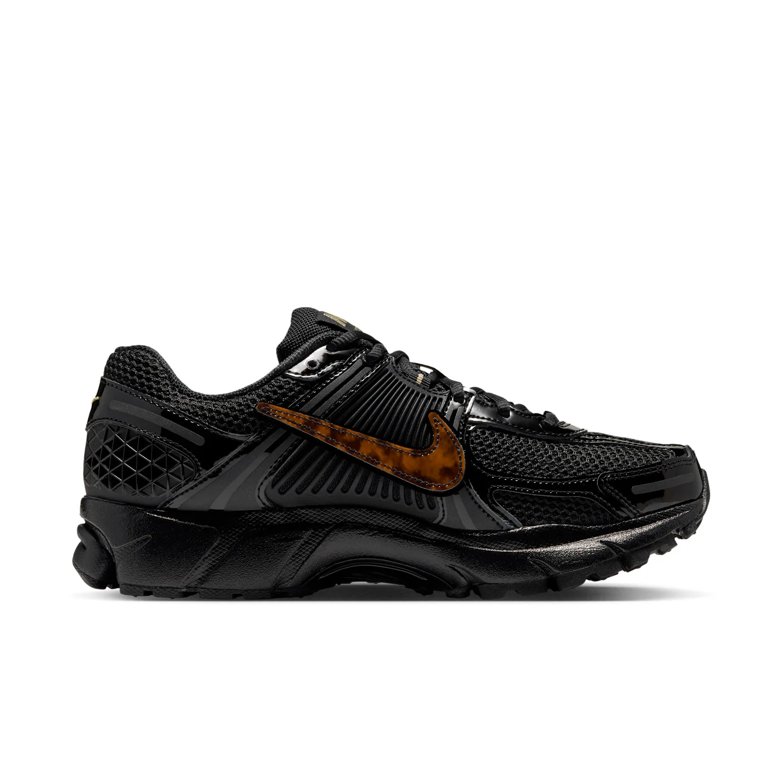 Medial view, black sneaker with tortoiseshell swoosh and textured triangular heel panel, Tortoise Shell
