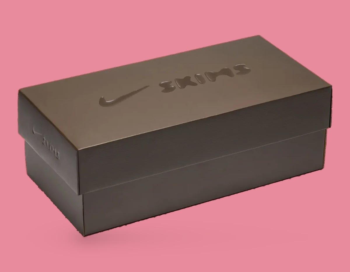Packaging, brown shoebox with embossed Nike swoosh and Skims logo on pink, University Red