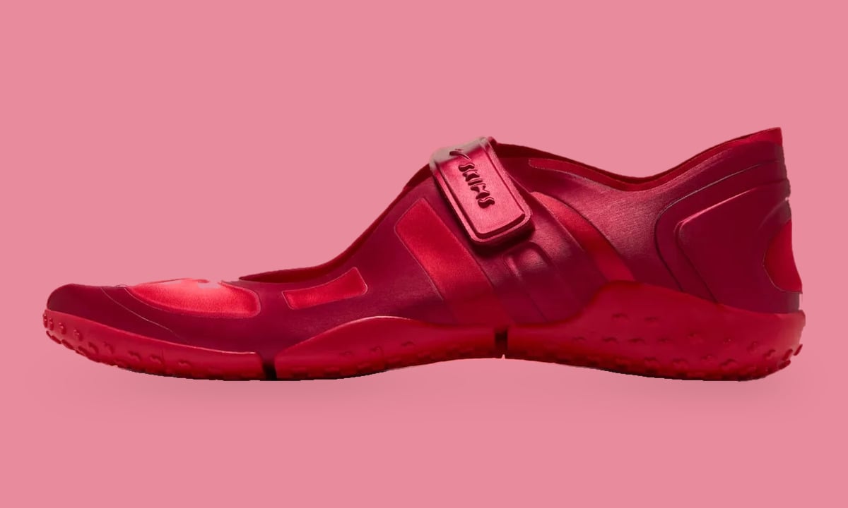 Lateral view, red satin upper with hook-and-loop strap and nubbed red sole, University Red