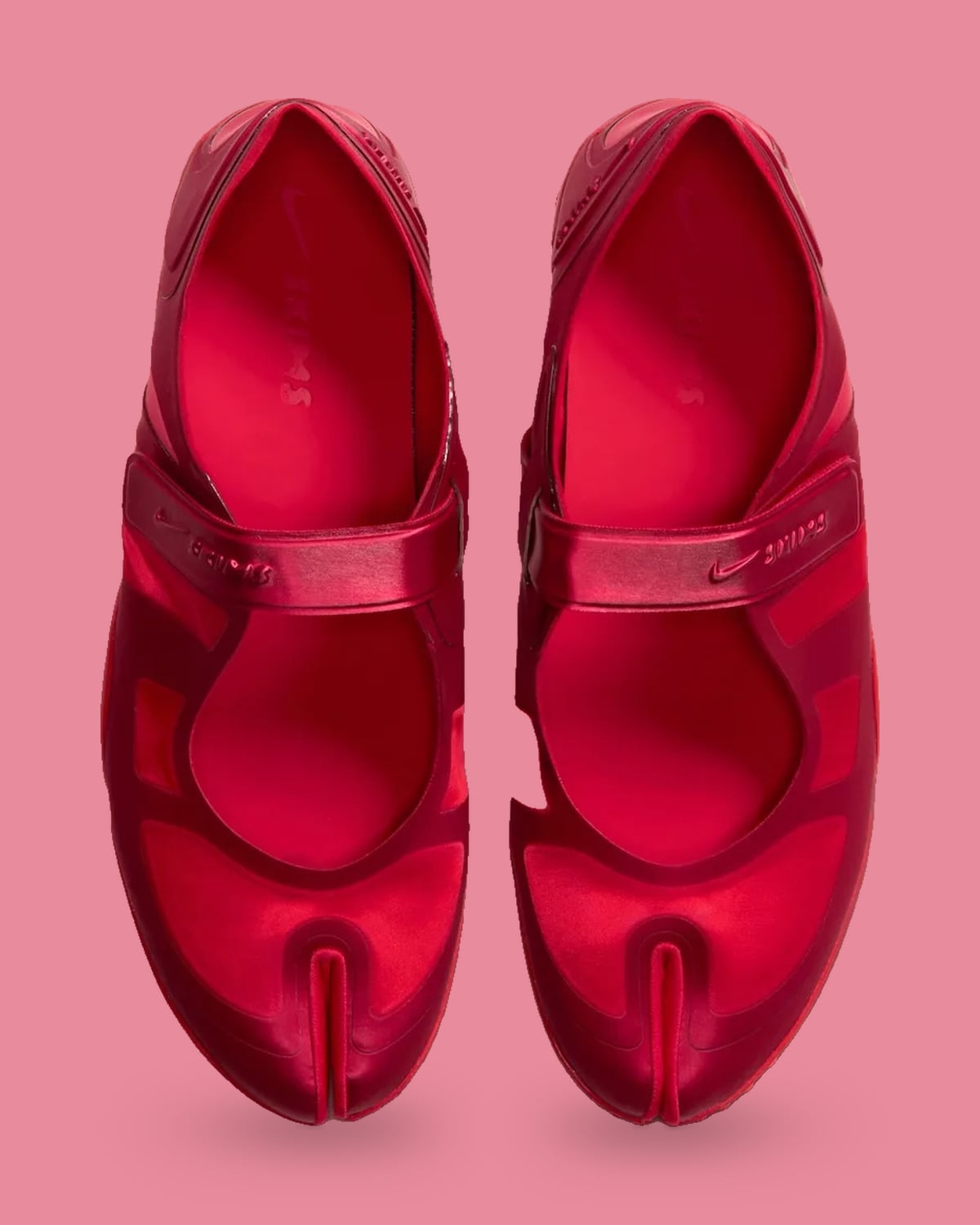 Top-down pair, red satin split toes, cross straps and embossed Nike Skims logos, University Red