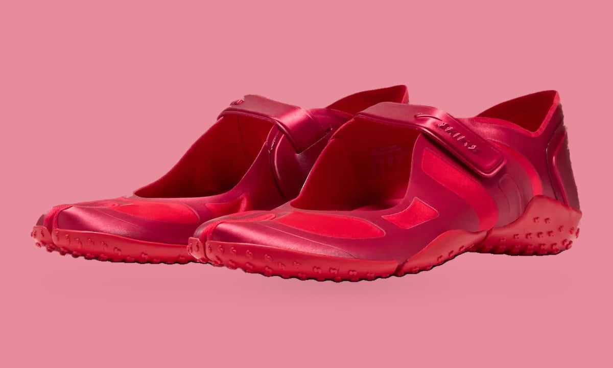 Pair, three-quarter view, red satin split-toe shoes with straps and nubbed soles, University Red