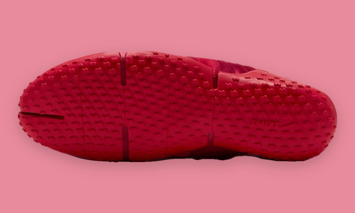 Outsole view, red sole covered in small raised nubs with flex grooves, University Red