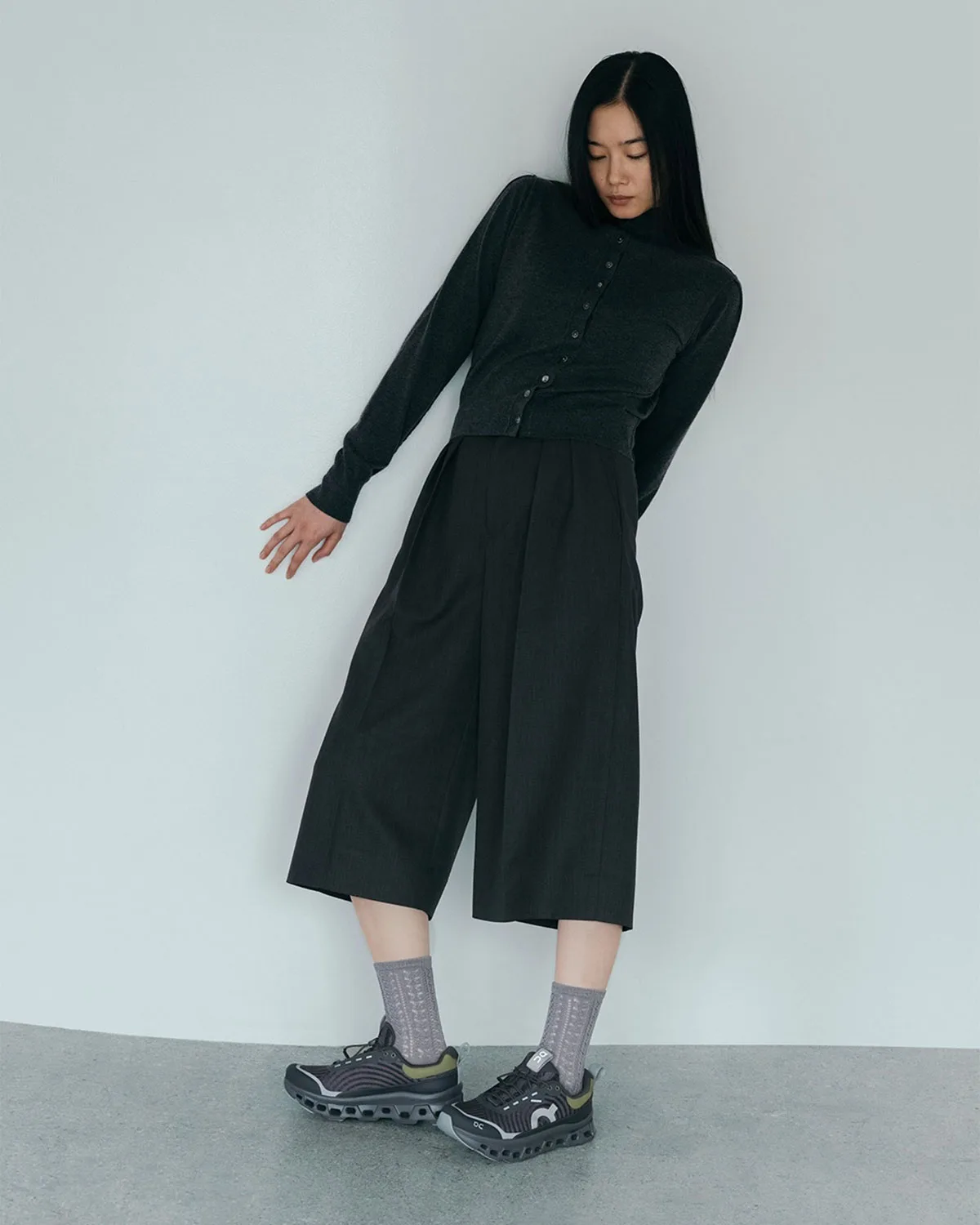 On-foot full-body shot, pair with grey socks, black cardigan and wide trousers, WP x atmos