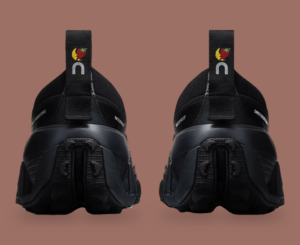 Heel view of black pair, pull tabs with strawberry-moon logo and On logo, Cloud Low Waterproof