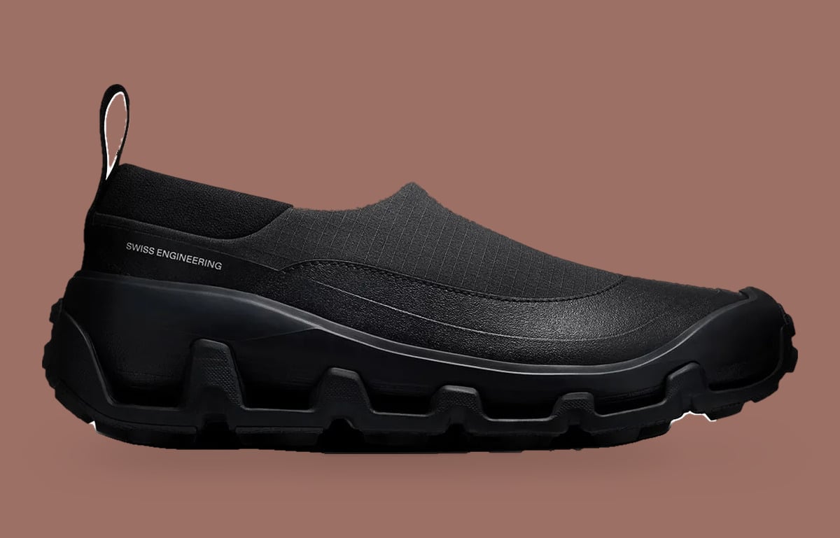 Lateral view of all-black slip-on with Swiss Engineering text and chunky lugged sole, Cloud Low Waterproof