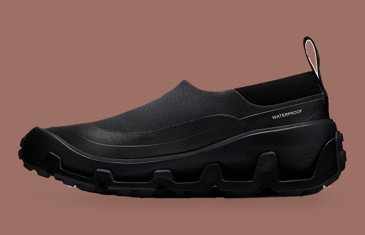 Medial view of all-black slip-on with Waterproof text and chunky lugged sole, Cloud Low Waterproof