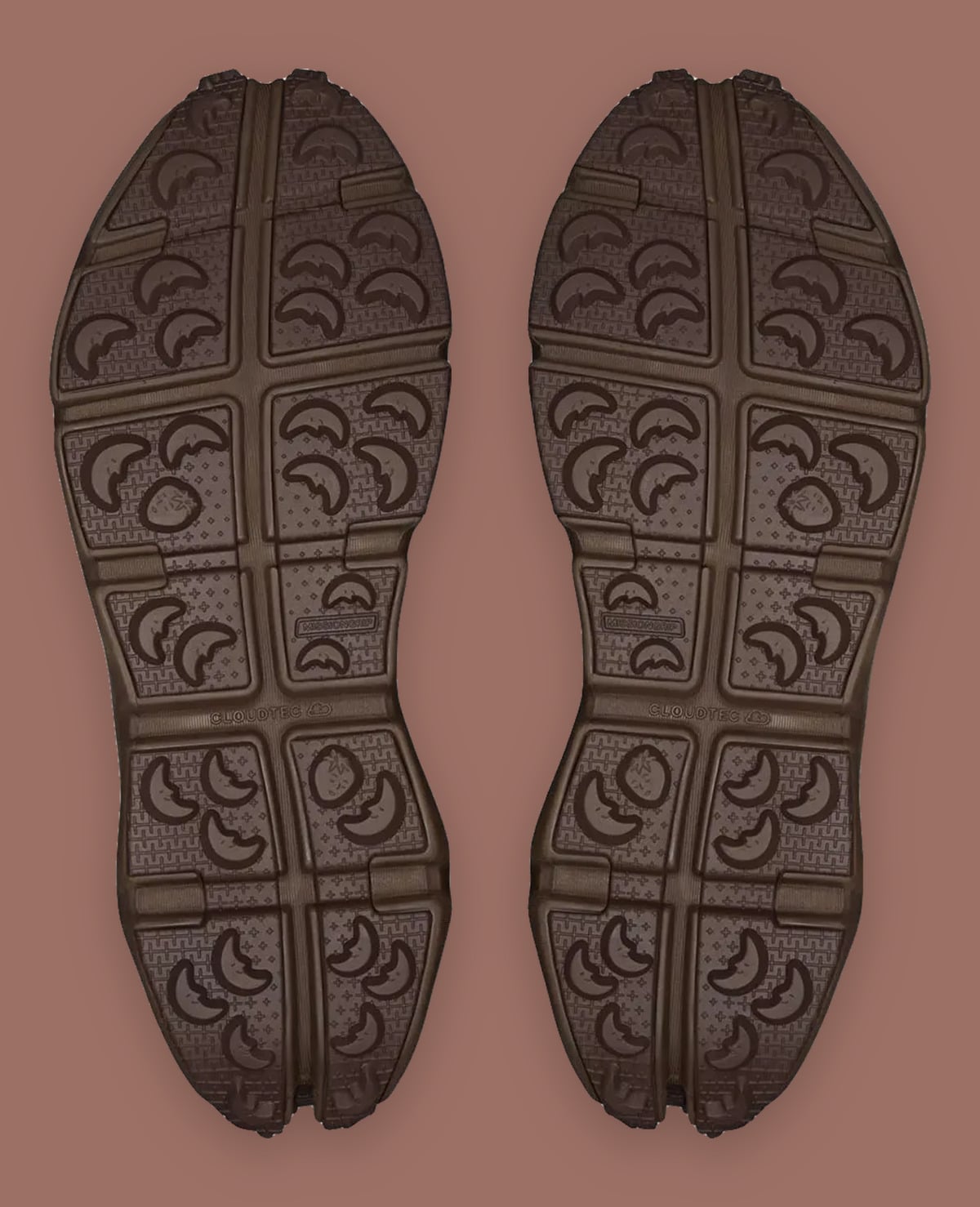 Outsole view of brown pair with moon-shaped lugs, Cloudtec text and strawberry motifs, Cloud Low Waterproof