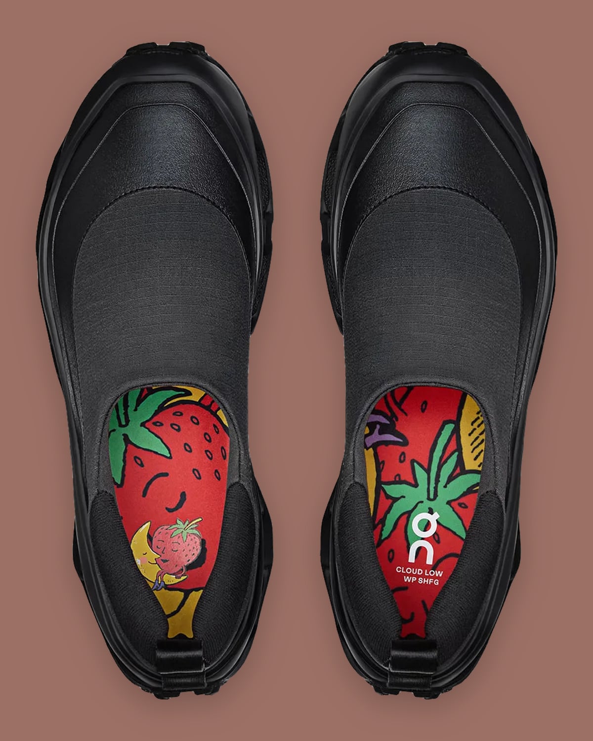 Top-down pair in black, red strawberry and moon insole art with On logo, Cloud Low Waterproof