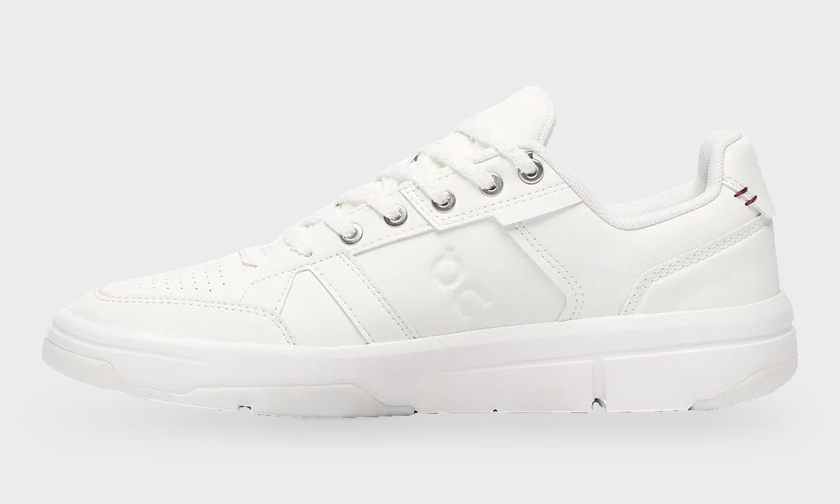 Medial view, all-white leather sneaker with silver eyelets and perforated toe, Burna Boy Collection